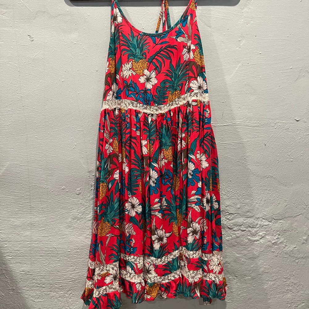 Strappy back with adjustable straps. Worn a few times.